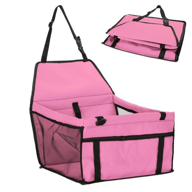 Pink pet seat cover with black straps on a white background
