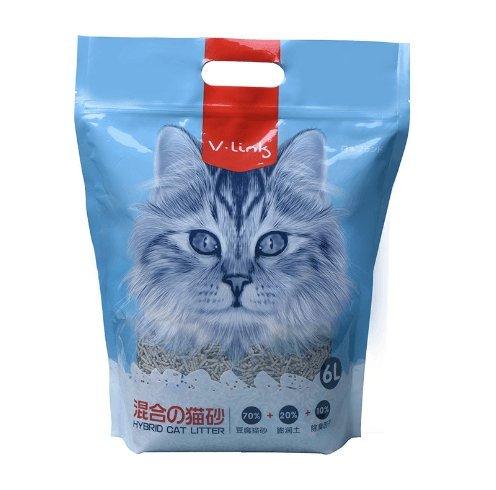 Cat litter package with a blue bag and red handle, featuring a cat's face on the front.
