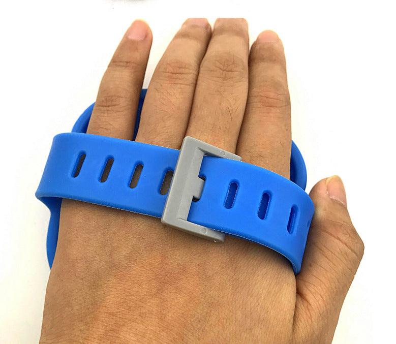 Blue wristband with a gray buckle on a hand against a white background