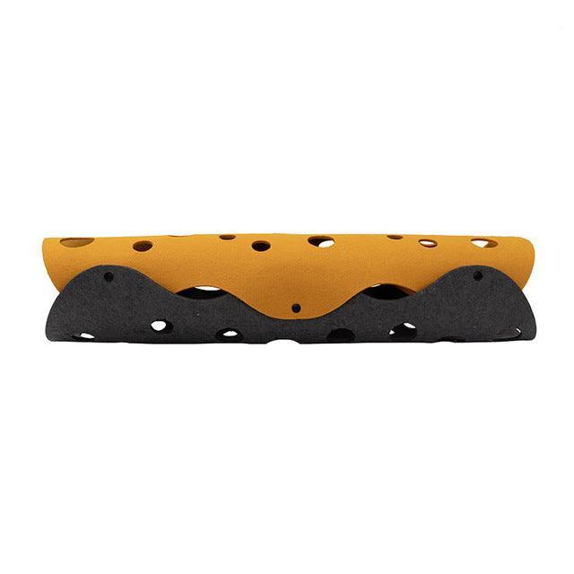 Two-tone orange and black object on a white background
