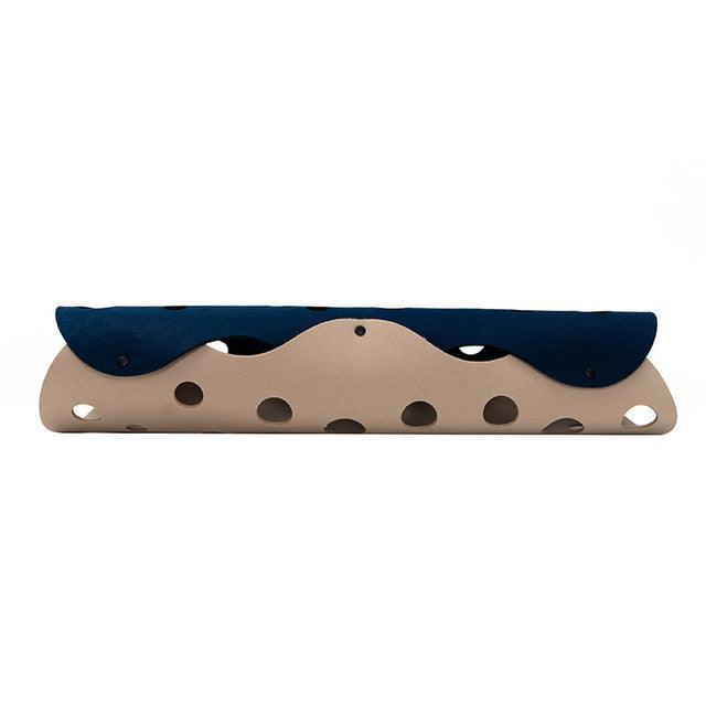 Wooden toy with blue top and beige bottom on a white background