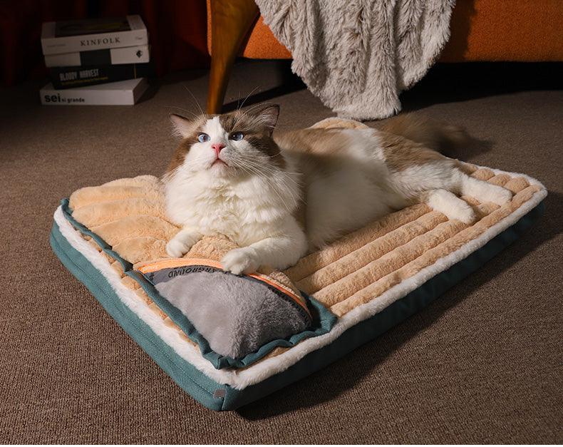 Cat lying on a cushioned pet bed in a cozy room.