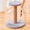 Cat tree with gray platform and brown cylindrical post on a wooden floor, featuring measurements.