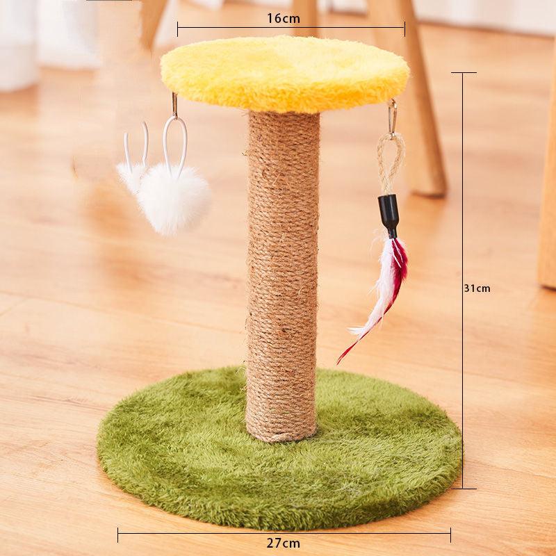 Cat tree with sisal-covered post, green base, and hanging toys on a wooden floor.