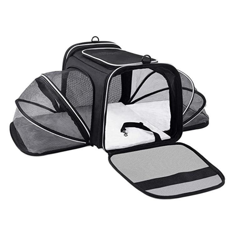 Pet carrier with open lid on a white background