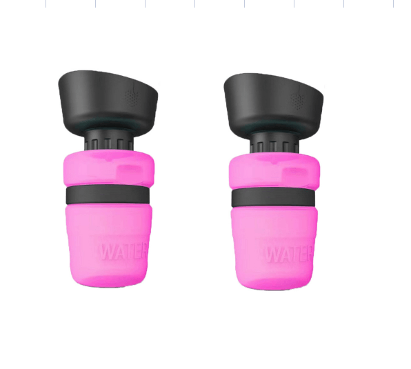 Two pink water bottle caps with black tops on a white background