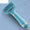 Blue handheld device with a metallic finish on a light blue background