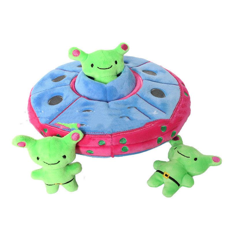 Toy set with a pink and blue UFO and green alien figures on a white background