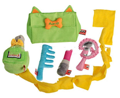 Set of pet toys including a green bag with cat ears, a yellow blanket, and various other toys on a white background.