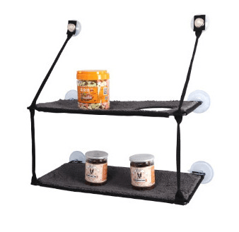 Two-tiered black shelf with suction cups on a white background