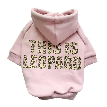 Pink dog hoodie with leopard print text on a white background