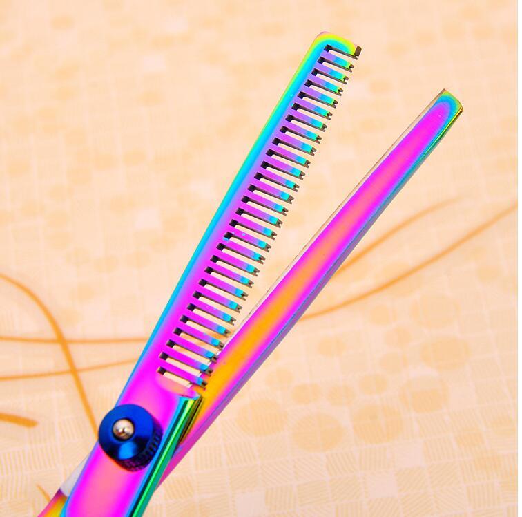 Multicolored scissor on a textured beige background