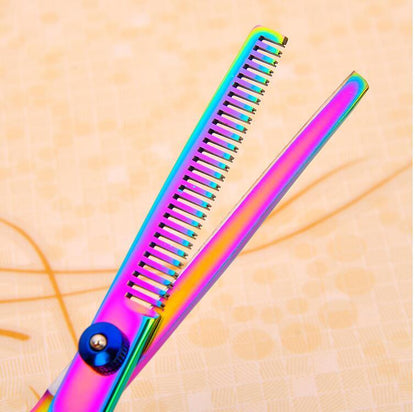 Multicolored scissor on a textured beige background