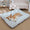 Dog lying on a checkered pet bed in a cozy living room.