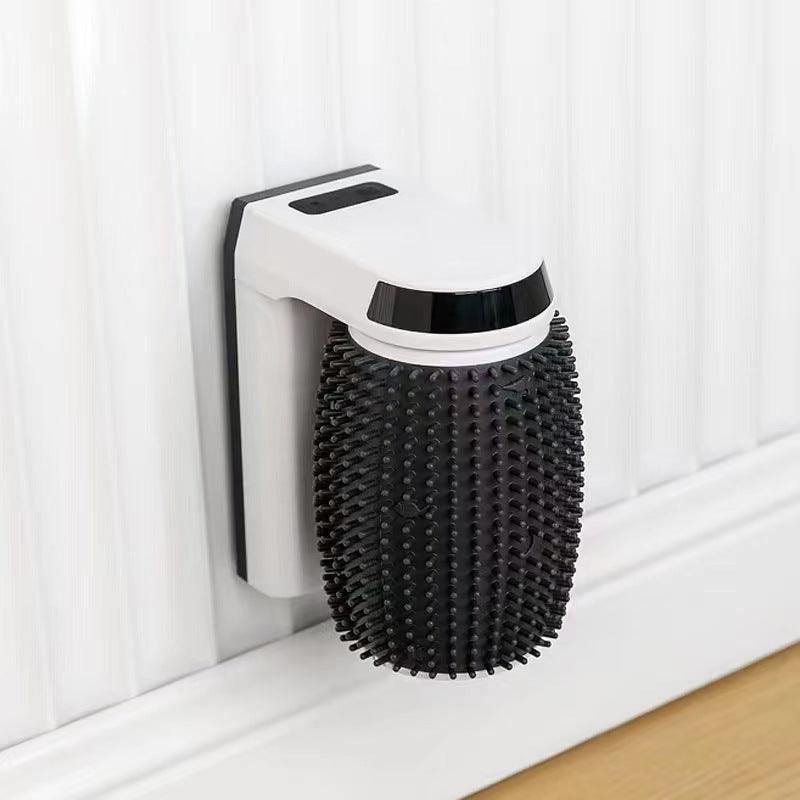 Black and white grooming tool attached to a wall