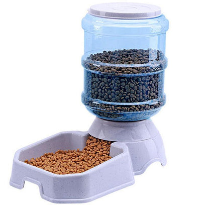 Pet food dispenser with two compartments filled with dry food on a white background