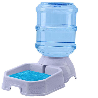 Pet water dispenser with blue water container and white base on a white background