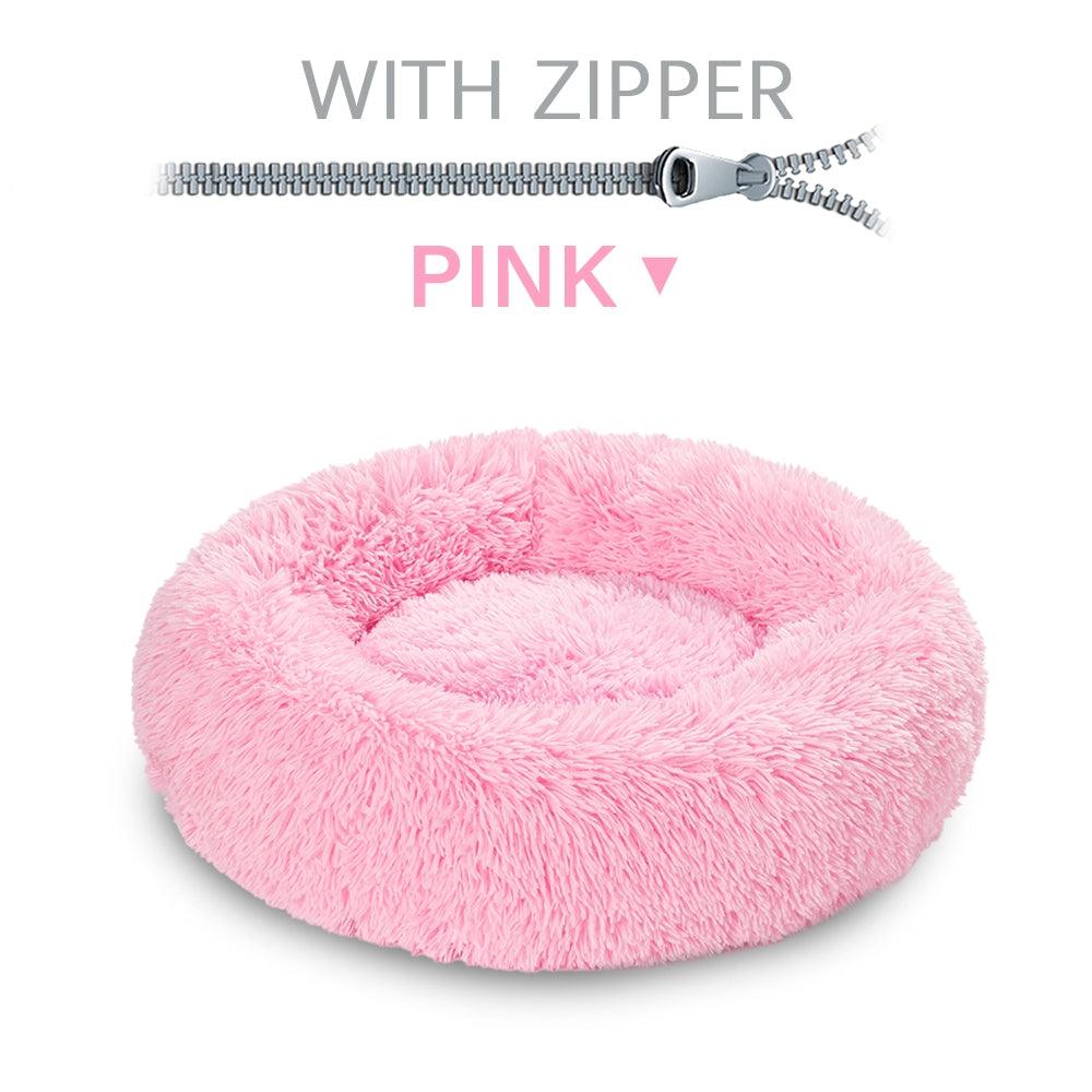 Pink fluffy pet bed with a zipper on a white background