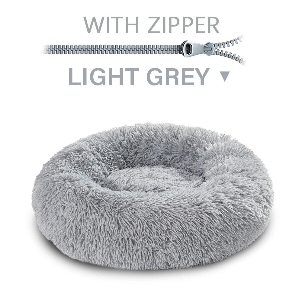 Light gray fluffy pet bed with a zipper on a white background
