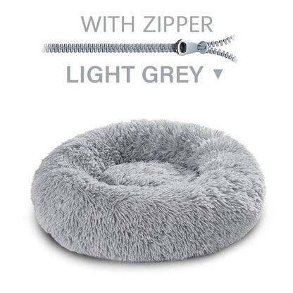 Light gray fluffy pet bed with a zipper on a white background