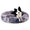 Dog lying on a fluffy gray pet bed against a white background