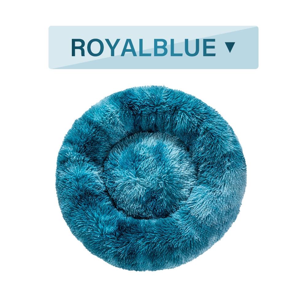 Fluffy blue pet bed with 'ROYALBLUE' label above it on a white background