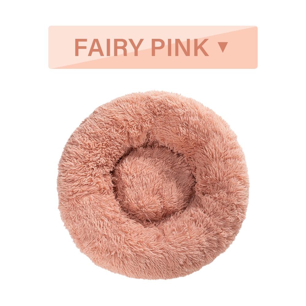 Fluffy pink pet bed with 'Fairy Pink' label on a white background