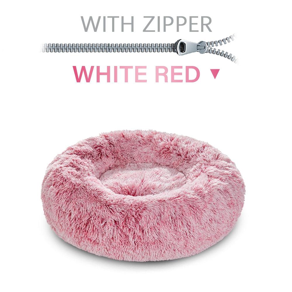 Pink fluffy pet bed with a zipper on a white background