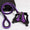 Purple and black dog harness and leash set on a white background