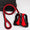 Red and black dog leash and harness set on a white background