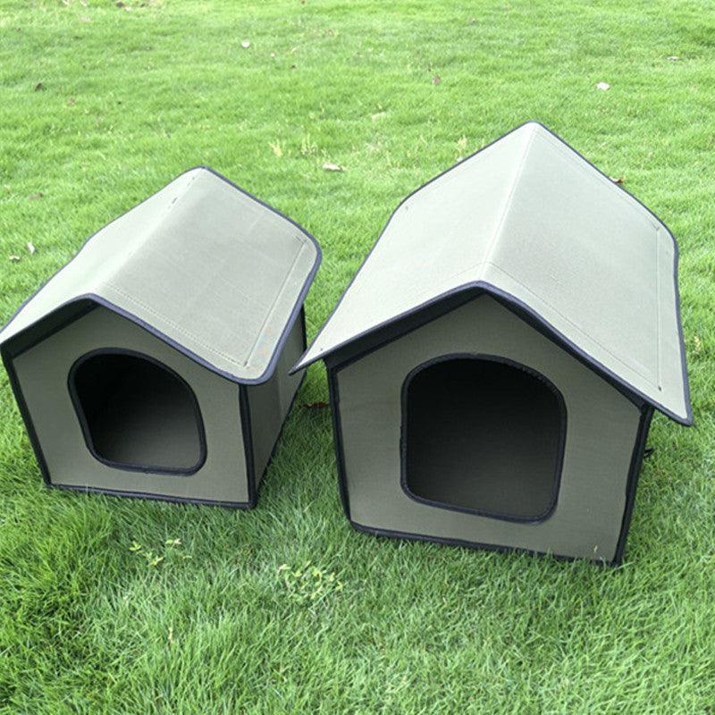 Two gray pet houses on a grassy background