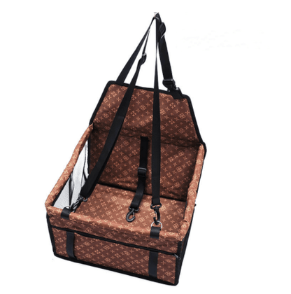 Brown patterned pet car seat with black straps on a white background