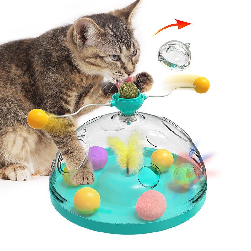 Cat playing with a colorful interactive pet toy