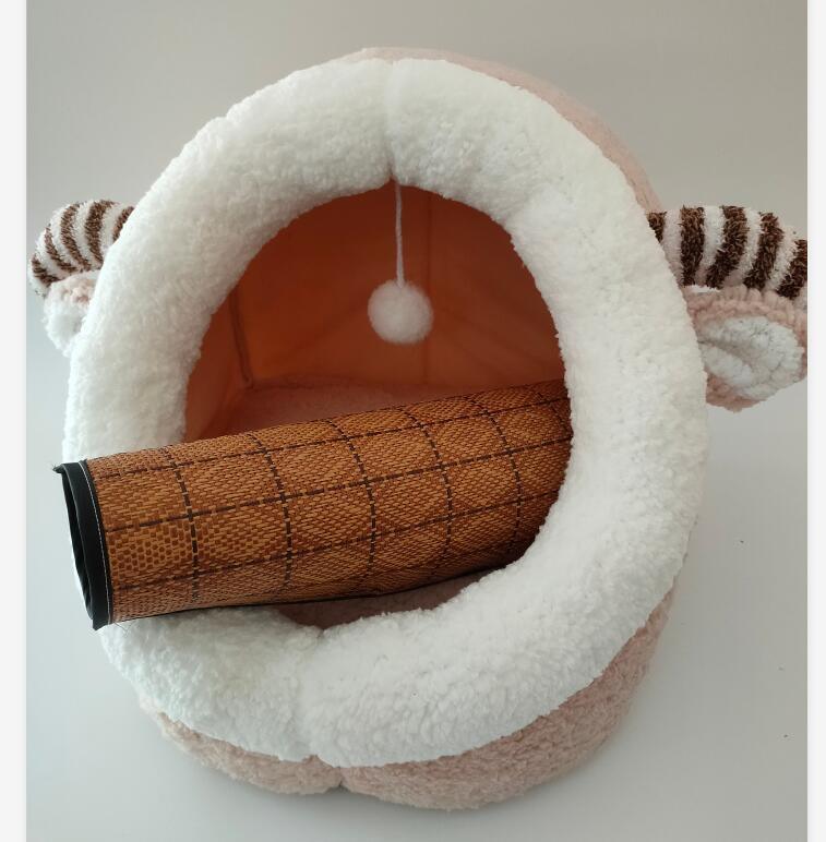 White pet bed with brown interior and striped ears on a light gray background